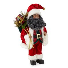 a christmas figurine with a santa suit and beard holding a fir tree in his hand