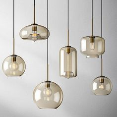 an assortment of hanging lights in various shapes and sizes