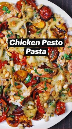 a white plate topped with pasta and veggies on top of a wooden table