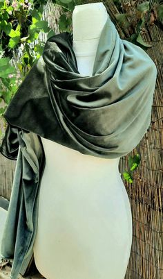 "Olive Green Velvet Shawl This shimmering lush shawl is chic elegant and cozy. Featuring rich velvet, it is the perfect accessory to upgrade your look. Made from a super soft lush velvet jersey knit fabric for a comfortable wear. Double sided, velvet on both sides! Stitched around the perimeter to prevent twisting and slipping! Gentle machine wash, lay flat to dry. ** 3 sizes available ** Measurements: Length: 80\" Width: 27\" Length: 70\" Width: 25\" Length: 60\" Width: 23\" There may be slight Emerald Green Shawl, Elegant Dupatta Scarf, Elegant Shawl With Traditional Drape, Elegant Dupatta Scarf For Wedding, Elegant Wedding Dupatta Scarf, Formal Shawl Wrap Scarf, Evening Shawl Wrap Scarf, Evening Shawl Wrap, Wedding Scarf Wrap Shawl