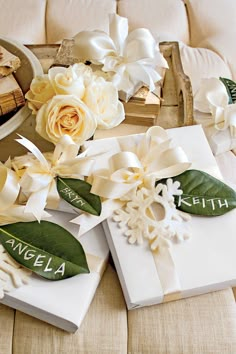 white flowers and personalized gifts on a table