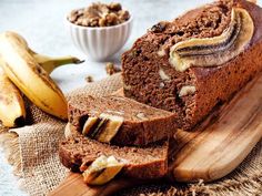 sliced loaf of banana nut bread on a cutting board