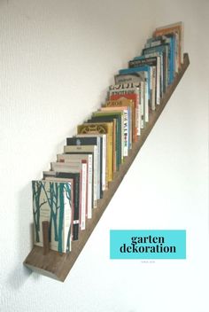 a book shelf with books on it and the words garden dekoraton above it