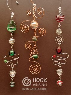 several different types of wire art hanging on a brown surface with the words hookwire art written below them