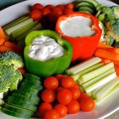 a white plate topped with veggies and dip