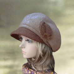 This felt wool  women's cap with visor is a very stylish. It has a small visor and decorated with 3 flowers which made of the same fabric as the cap.  It is quite soft to the touch. 100% WoolThe cap has elastic behind to insure comfy fit. The cap  fits an average size women's head. Lightweight and warm at the same time suitable for all occasions. This headpiece is a timeless classic and great for all ages. Features a visor is great for a hip, trendy look. It will  keep you warm, yet you will  lo Winter Brimmed Beret One Size Fits Most, Winter Wool Brimmed Beret, Wool Visor Hat For Fall, Fall Wool Visor Hat, Fall Wool Hat With Visor, Brown Cloche Cap For Fall, Winter Flat Cap Hat One Size Fits Most, Beige Visor Hat For Fall, Winter Flat Cap One Size Fits Most