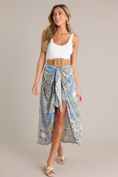 Free Spirit Blue Multi Faux Wrap Skirt Printed Mini Skirt For Vacation, Flowy Wrap Skirt For Beachwear In Spring, Spring Beachwear Wrap Bottoms, Blue Belted Summer Bottoms, Summer Belted Long Skirt, Blue Midi Skirt For Vacation, Chic Blue Asymmetrical Maxi Skirt, Blue Printed Beach Skirt, Bohemian Beach Skirt With Tie Waist