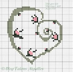 a cross stitch pattern with a cat's face in the shape of a circle