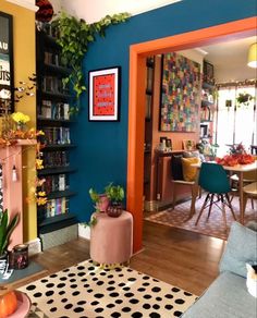 a living room filled with lots of furniture and decor