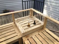 a wooden bench with two bottles on it