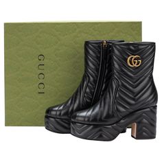 GUCCI Marmont plateau boots made of nappa leather with a golden GG logo at the shaft. The heel is 3.5 inches and the plateau 1.75 inches. The boot is 7 inches high in total and comes in EU size 37.5 US Size 7. The shoes are new and come with the original box and dustcovers. Gucci Fitted Boots With Round Toe, Black Gucci Boots With Branded Heel, Gucci Black Luxury Boots, Gucci Black Round Toe Boots, Gucci Black Boots With Reinforced Heel, Plateau Boots, Gucci Boots, Gucci Marmont, Gg Logo