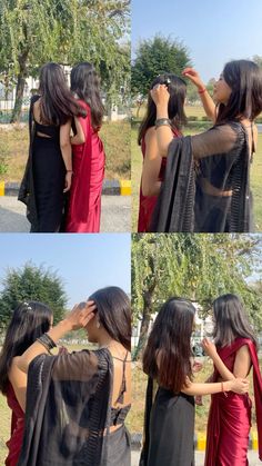 two women in red and black sari are touching each other's foreheads