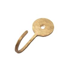 a gold ring with a hole in the middle on a white background, it is made out of metal