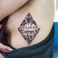 a woman with a tattoo on her stomach that says xxvi xix is always