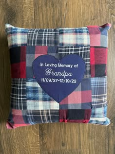 a blue and red plaid pillow with the words in loving memory of grandpa on it