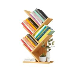 a bookshelf with many books on top of it and a potted plant next to it