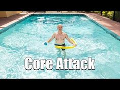 a man holding a frisbee in a pool with the words core attack on it