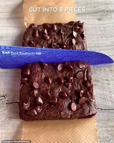 two brownies with chocolate chips and a blue knife on top of each one that says cut into 8 pieces