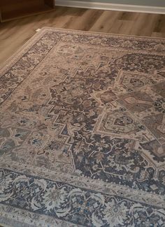 an old rug is laying on the floor