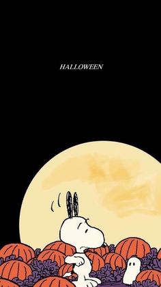 a snoopy halloween scene with pumpkins in the background and a full moon behind it