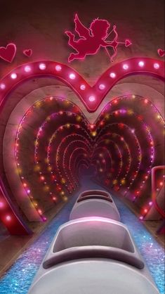 a large heart shaped room with lights on the ceiling