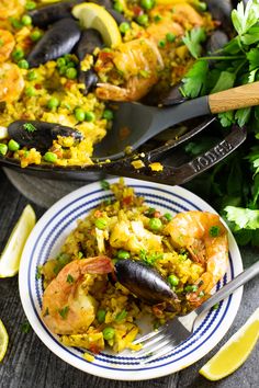 a close up of a plate of food with shrimp and rice