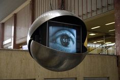 an eyeball hanging from the side of a building