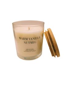 a small glass candle with a wooden lid