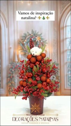 a teddy bear sitting on top of a potted plant with berries and pine cones