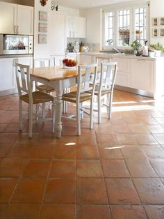 a dining room table and chairs in a kitchen