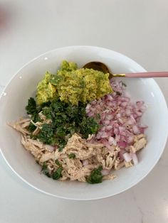 a white bowl filled with different types of food