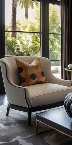 a living room filled with furniture and large windows