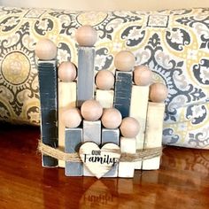 a group of wooden pegs sitting on top of a table next to a pillow