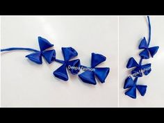 two pictures showing how to make an origami flower with blue ribbon and bows