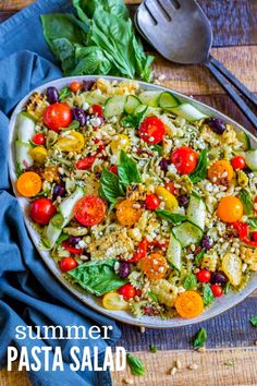 a salad with tomatoes, cucumbers, and other vegetables on a wooden table