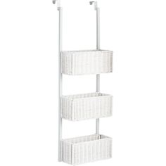 three white wicker baskets are hanging on a metal rack against a white wall and the bottom shelf is empty