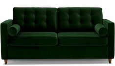 a green velvet couch with wooden legs and arm rests on an isolated white background,