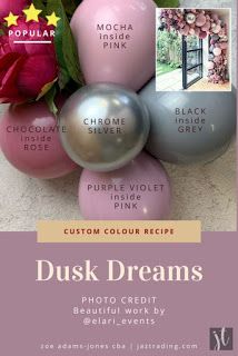 some pink and grey balloons are on the ground with flowers in front of them that say, dusk dreams