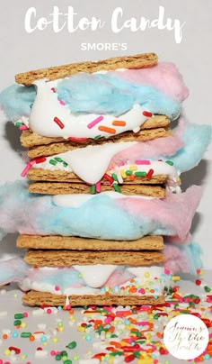 some cookies and marshmallows are stacked on top of each other with sprinkles