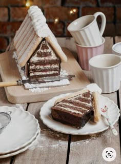 a slice of cake sitting on top of a white plate next to a cup and saucer