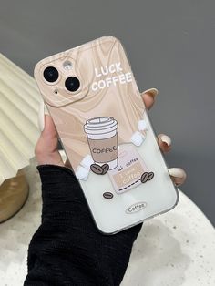 a person holding up a phone case with a coffee design on the front and side