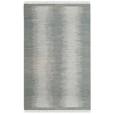 a rug with grey and white stripes on the bottom, in front of a white background