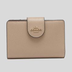 Nwt Coach Medium Corner Zip Wallet Taupe Details 100% Authentic,Money Back Guaranteed Crossgrain Leather Seven Credit Card Slots Bill Compartment Id Window Zip Pocket Snap Closure 5" (L) X 3 1/2" (H) X 1/2" (W) Cream Leather Bifold Wallet, Classic Coin Purse With Interior Card Slots, Classic Bifold Cream Wallet, Classic Everyday Cream Wallet, Classic Cream Bifold Wallet, Elegant Beige Wallet With Coin Pocket, Elegant Beige Wallets With Coin Pocket, Classic Beige Leather Wallet, Coach Rectangular Wallet With Snap Closure