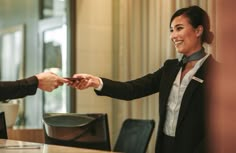 two business people shaking hands in an office