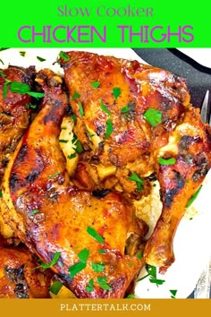 a plate with chicken wings and garnishes on it, in front of the words slow cooker chicken wings