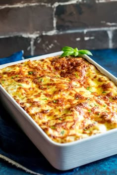 a casserole dish with cheese and herbs