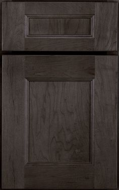 a close up view of the front and side of a kitchen cabinet with dark wood grained finish