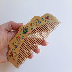 a handmade wooden comb designed with Persian painting. made with boxwood, well polished. Persian Painting, Christmas 2025, Wooden Comb, House Crafts, Hair Combs, Hair Comb, Handmade Wooden, Comb, Persian