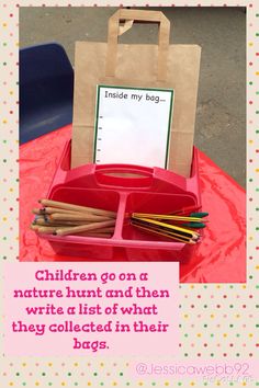 a pink table topped with a brown paper bag filled with sticks and pencils on top of it