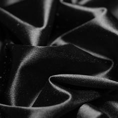 black silk fabric textured with small dots